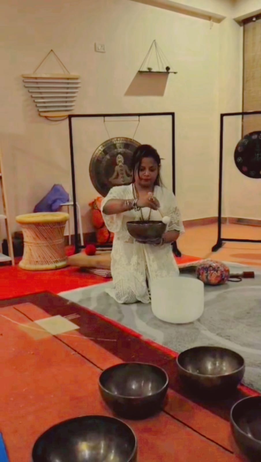 Sound healing training room with bowls and sacred instruments